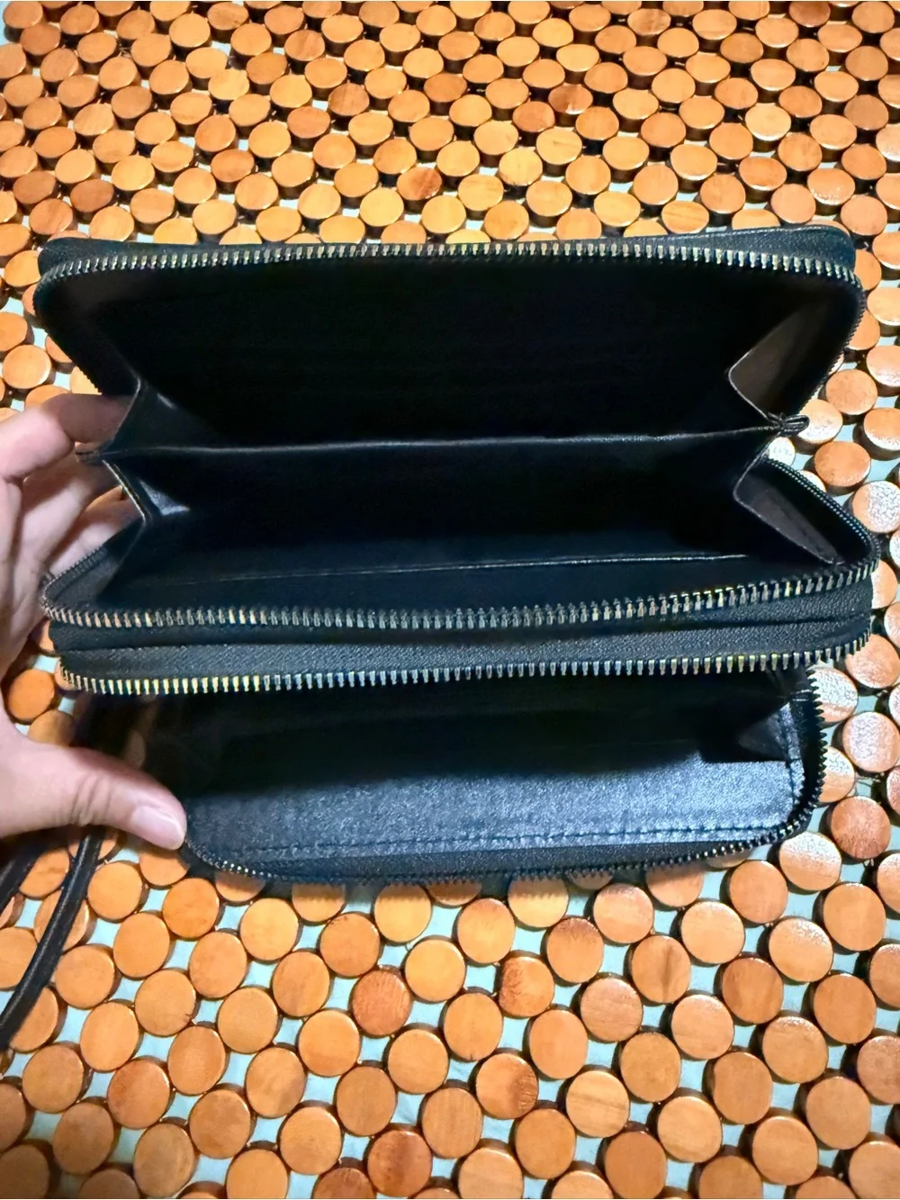 Classic Black Wristlet Clutch with Decorative Gold Emblem
